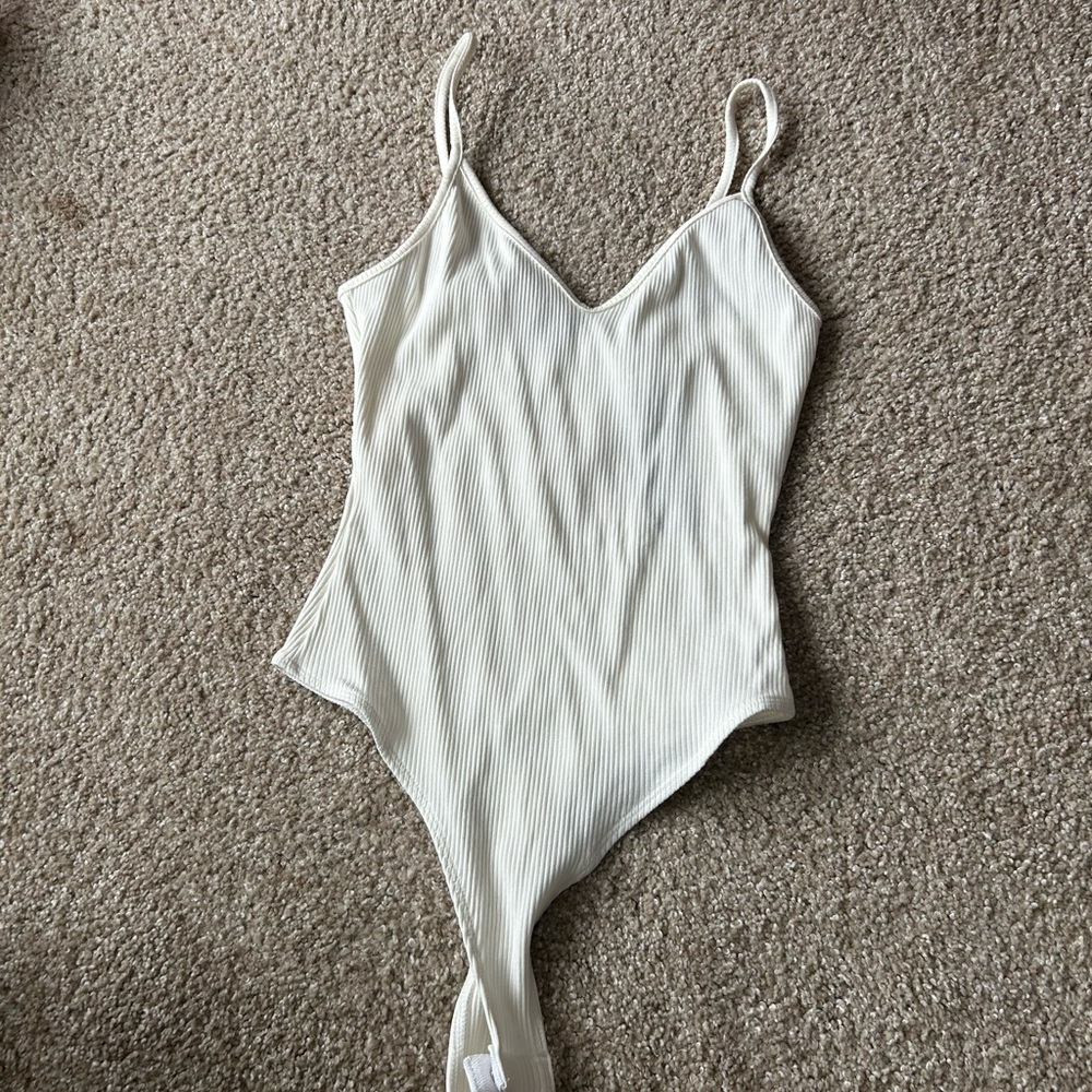 Lulu’s Body suit. Size Medium with Tags.